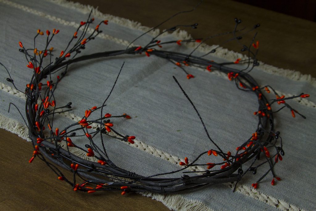 garland wrapped around brass ring